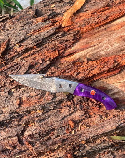 Handmade folding knife with leather sheath