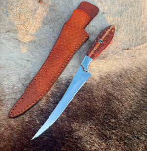 custom handmade fillet/hunting knife with a long, narrow and curved blade used for skinning or filleting with genuine leather sheath